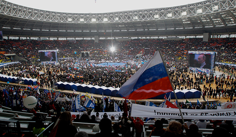 Putin presidential rally: Vladimir Putin on stage addresses a rallyat Luzhniki stadium 