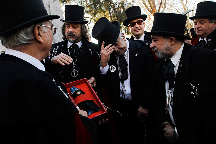 24 hours in pictures: Madrid, Spain: Carnival revellers dressed up as mourners