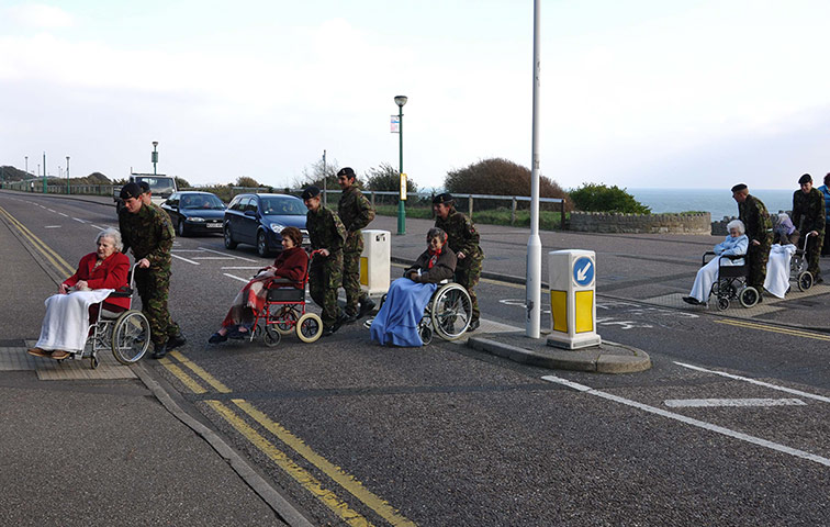 Weekend Readers Pictures: Army officers pushing wheelchairs near the seafront by Scott Sinclair
