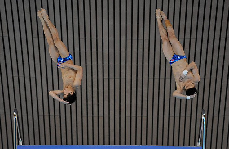 Diving Thursday: Yuan Cao and Yanquan Zhang of China at the FINA Diving world cup