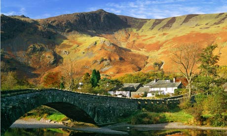 Grange in autumn, Lake District National Park, Cumbria, UK. Bridge over River Derwent.