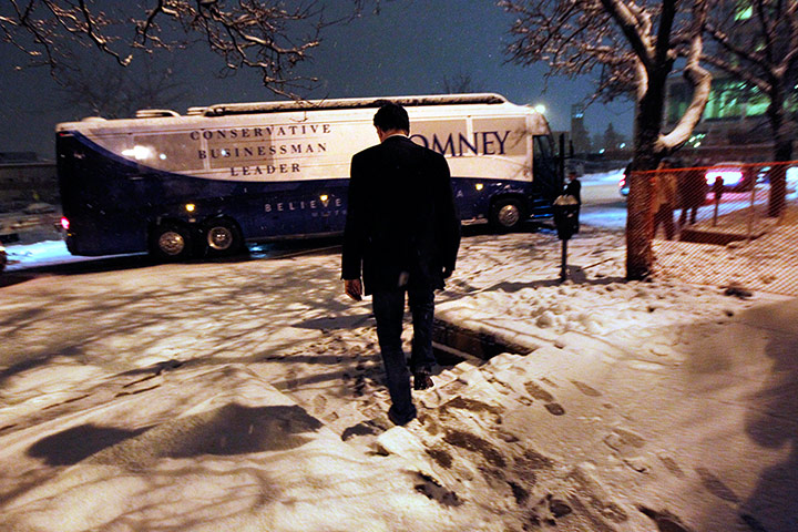 24 Hours: Mitt Romney walks to his campaign bus after a town hall meeting in Michigan