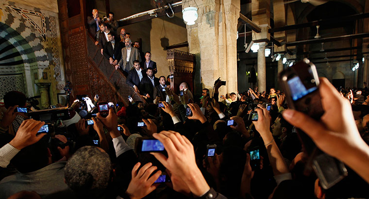 24 Hours: People take photographs as Gaza's Hamas Prime Minister Ismail