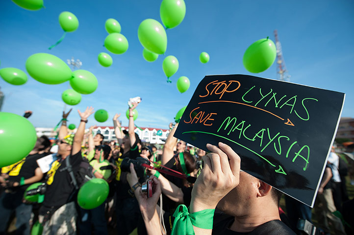 24hours: An activist displays a placard during Green Gathering in Malaysia