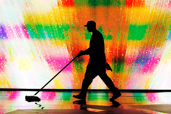 24hours: A stage hands cleans the floor during rehearsals for 84th Academy Awards 