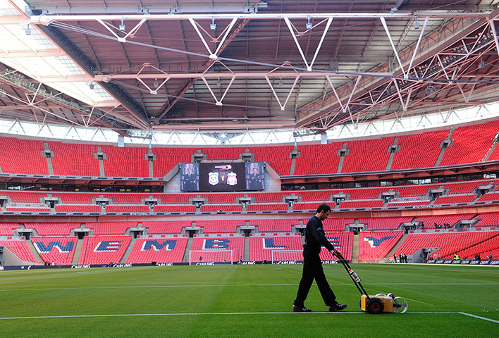 CARLING CUP FINAL: The lines on the Wembley pitch are given a lick of paint