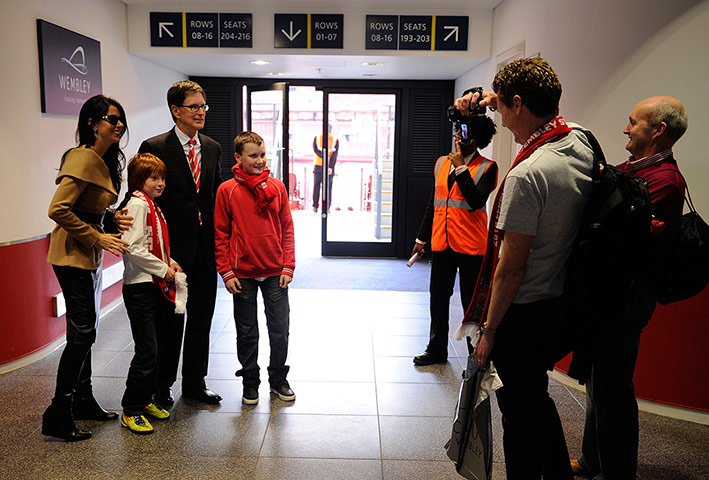 CARLING CUP FINAL: Liverpool owner John Henry meets a couple of young Reds supporters