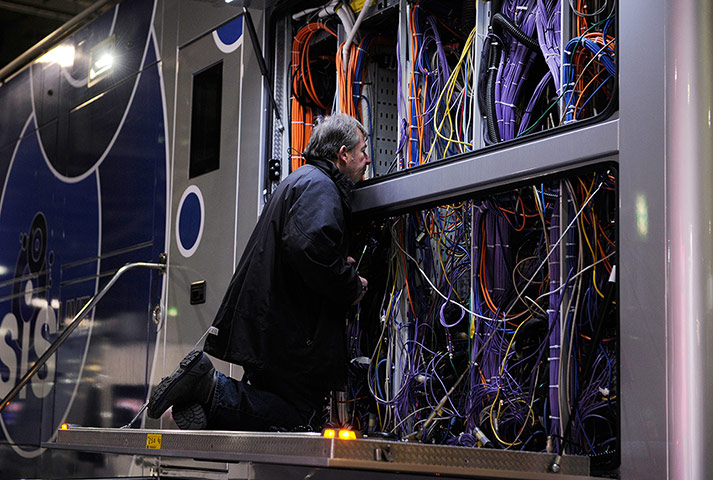CARLING CUP FINAL: A TV technician works amid a mass of cables at the Carling Cup Final