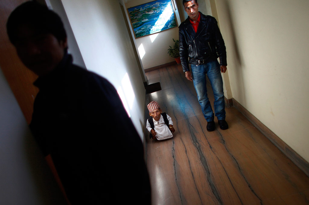 Dangi walks in a guesthouse just hours before he was to be measured 