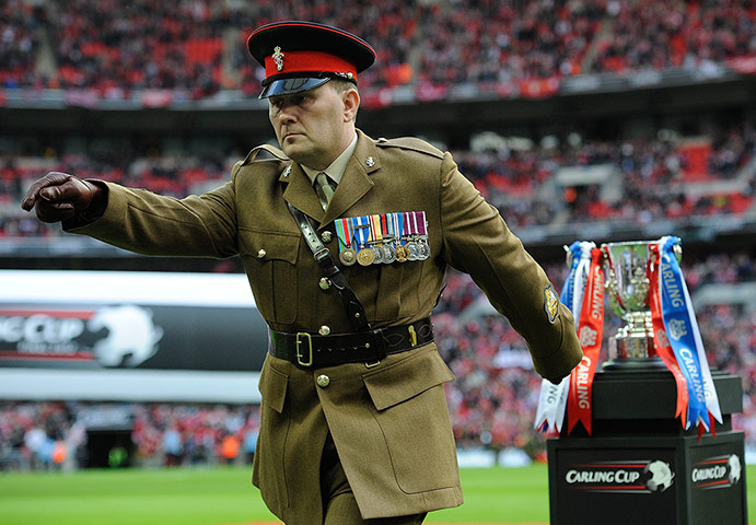 Carling Cup: Soldier places the Carling Cup on the plinth