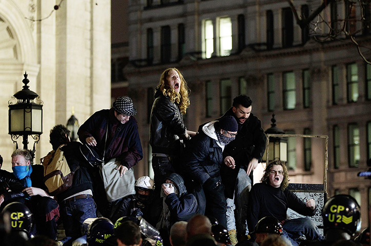 Occupy London eviction: Protesters shout as they stand on a barricade