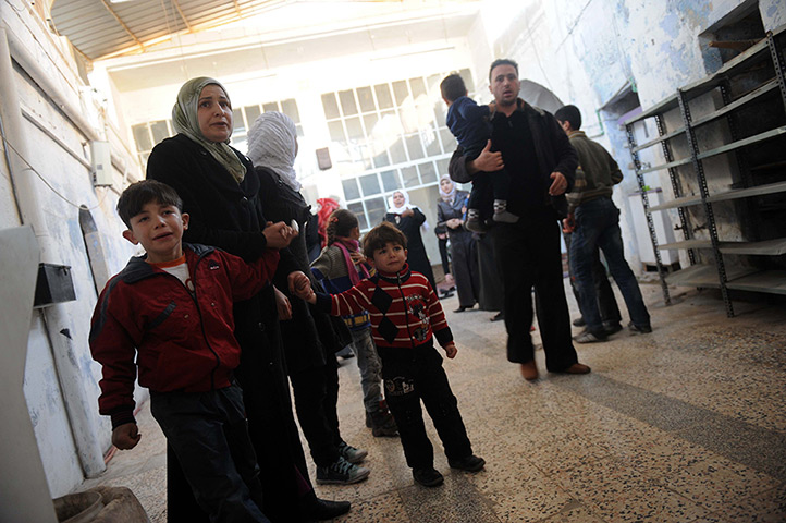  24 hours: Idlib, Syria: Syrians take shelter following an attack in the centre