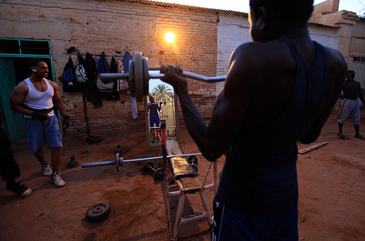 24 hours : Khartoum, Sudan: A member of the national weightlifting team lifts weights