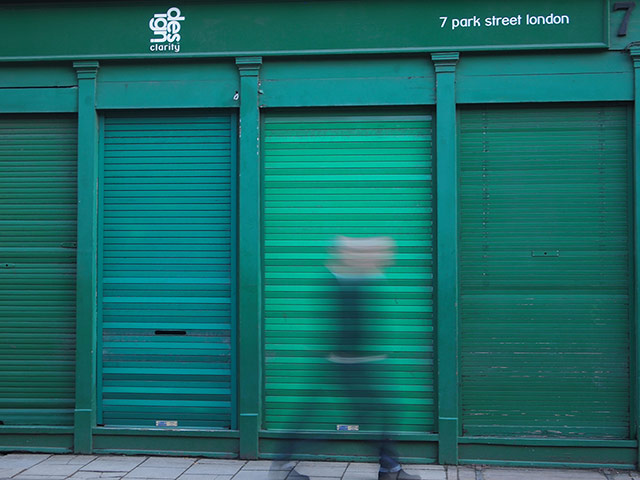Readers' Pictures: Man walking past green shutters