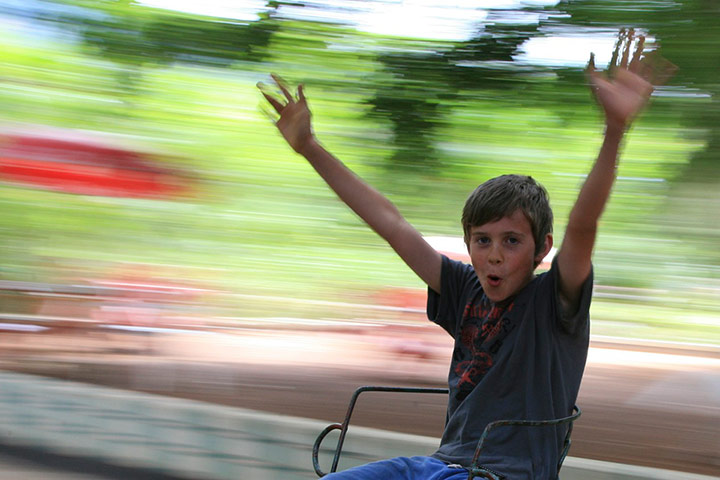 weekend readers pics: boy on a roundabout in Tanzania