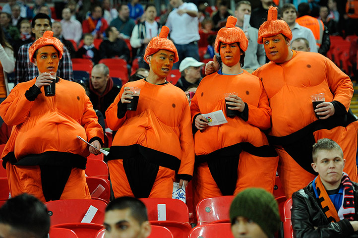 England v Holland: Dutch fans in Sumo costumes