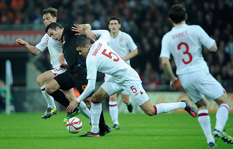England v Holland: Scott Parker and Chris Smalling deal with Robin van Persie