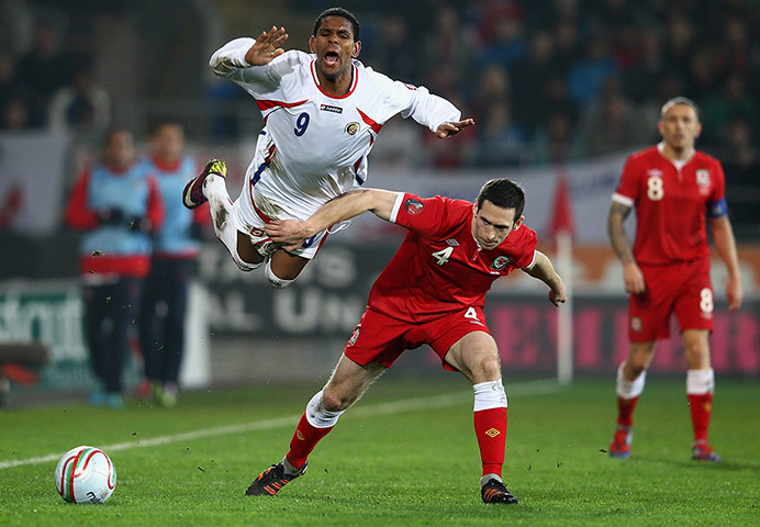 Wales v Costa Rica: Costa Rica's Kenny Cunningham is stopped by Wales' Andrew Crofts 