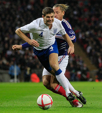 England Captains: England's Steven Gerrard is challenged by France's Philippie Mexes