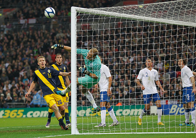 England Captains: England goalkeeper Joe Hart makes a save against Sweden