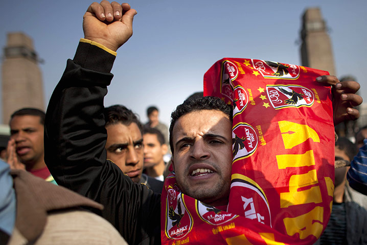 Egypt clashes: A demontrator wears a scarf of the football team al-Alhy