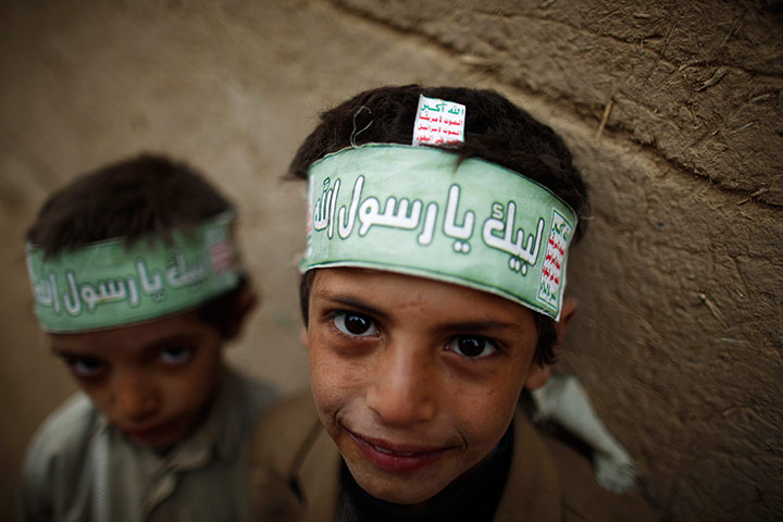 24 Hours: Boys pose for a photo while playing in Saada