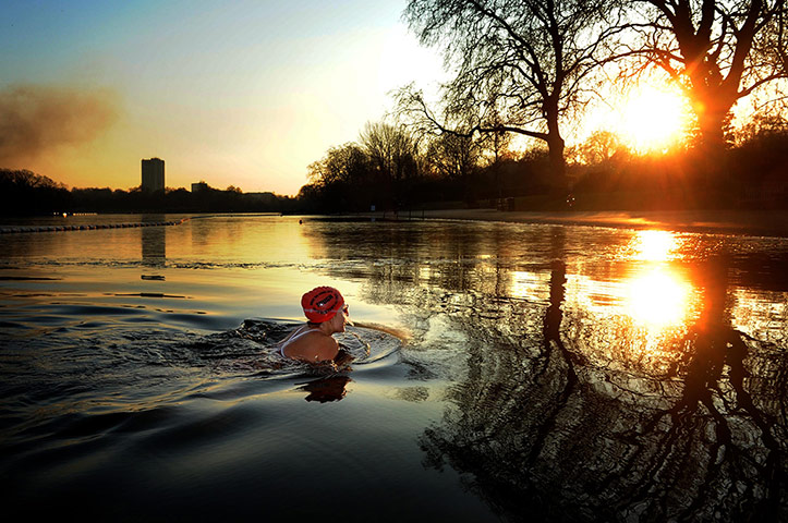 24 Hours: A woman braves the early morning cold weather to swim in the Serpentine