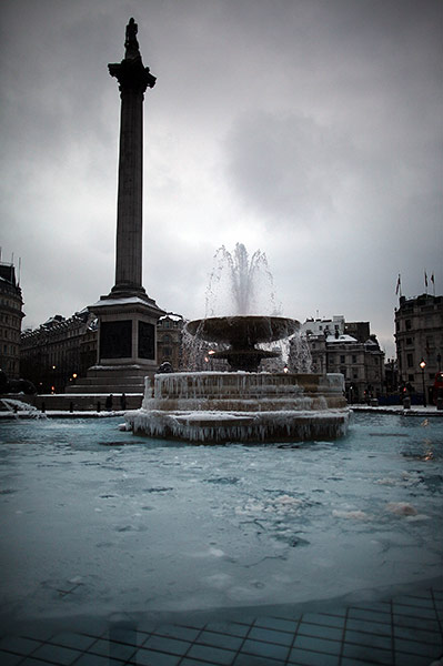 UK snow: A partly frozen fountain in Trafalgar Square in London