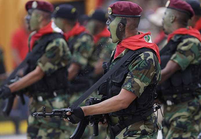 24 hours: Caracas, Venezuela: Soldiers march during a military parade 