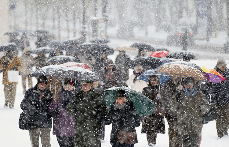 Europe weather: Pedestrians walk through a park in Burgos, Spain