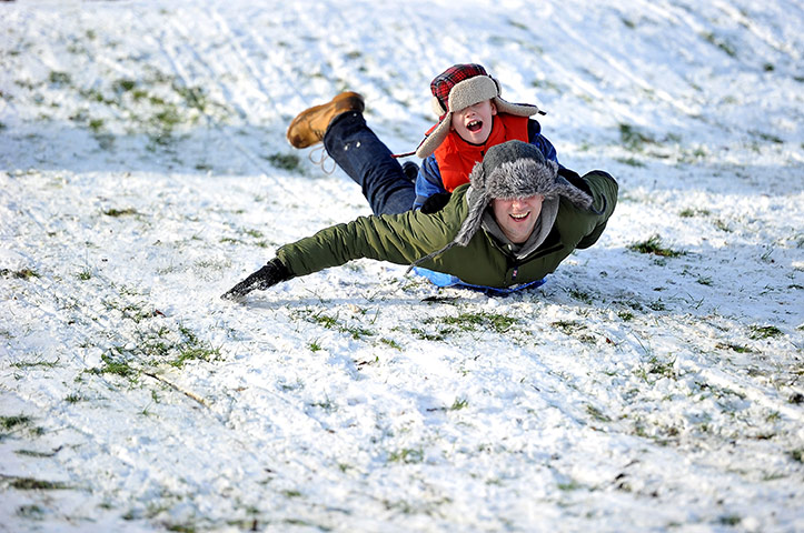 Europe weather: A father and son enjoy playing in the snow in Harrogate, UK