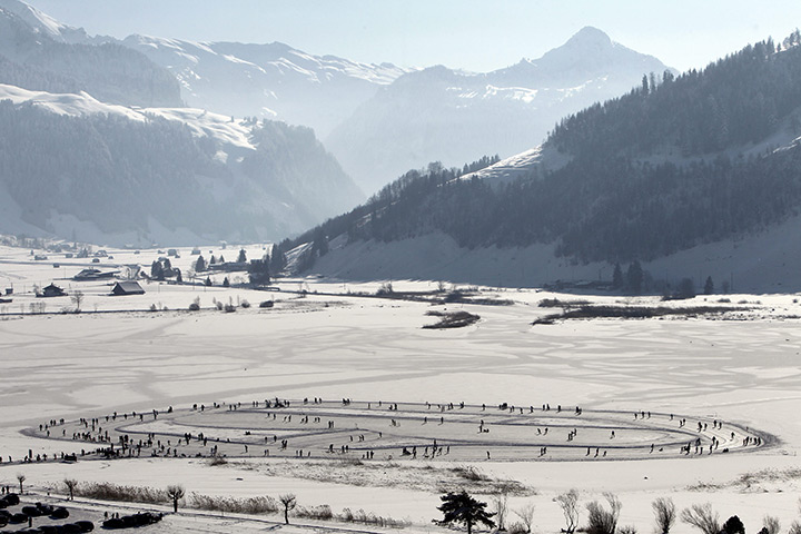 24 hours: Switzerland: People skate on the frozen Sihlsee lake 