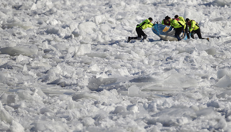 24 hours: Quebec City, Canada: Team Innovex in the ice canoe race at Winter Carnival 