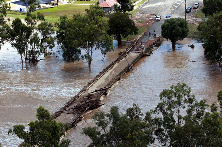 Queensland flooding Debris covering the main bridge over the Maranoa river 
