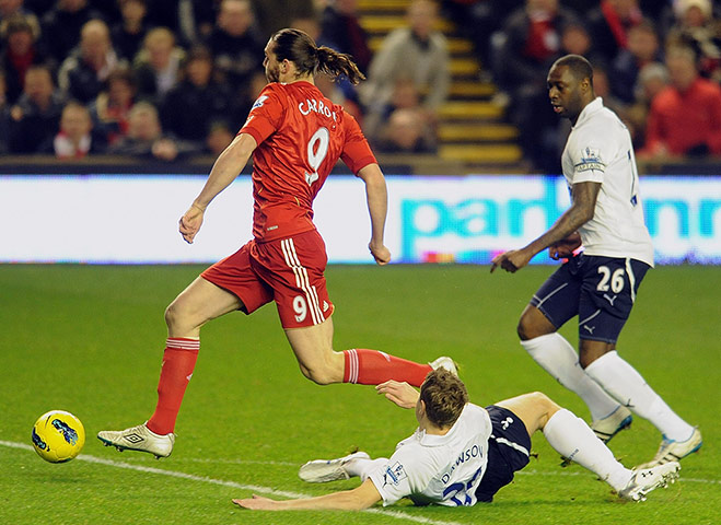 Liverpool v Spurs: Michael Dawson tackles Andy Carroll