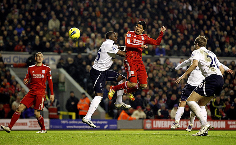 Liverpool v Spurs: Luis Suarez heads the ball towards the Tottenham goal