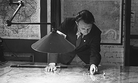 Air Raid Precaution wardens mark the positions of enemy planes on a large map