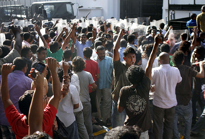 Maldives unrest: Opposition supporters celebrate after the resignation of President Nasheed
