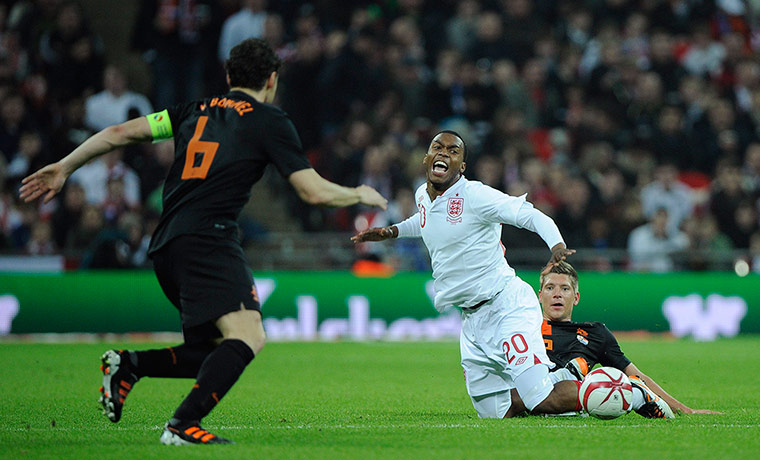 England v Holland: Daniel Sturridge fouled by Stijn Schaars