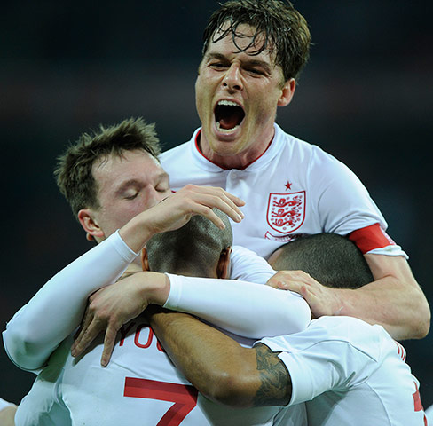England v Holland: Scott Parker celebrates with team-mates after Ashley Young scored
