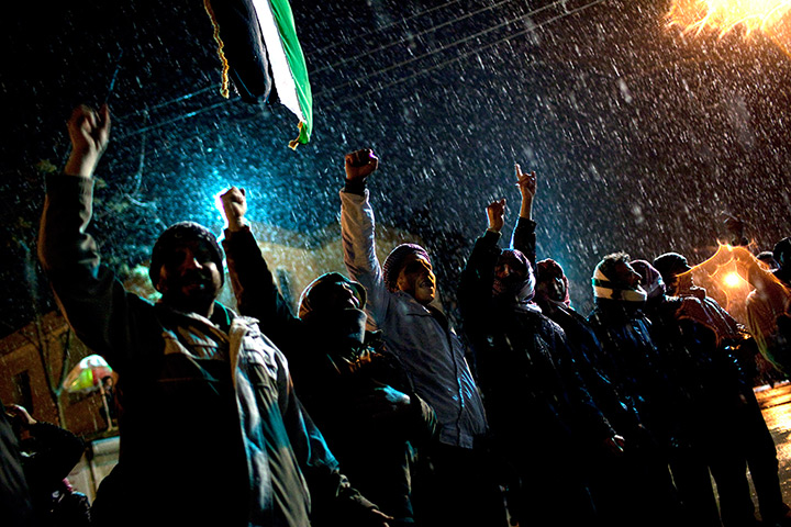 24 hours in pictures: Free Syrian Army supporters chant under snowfall, Idlib