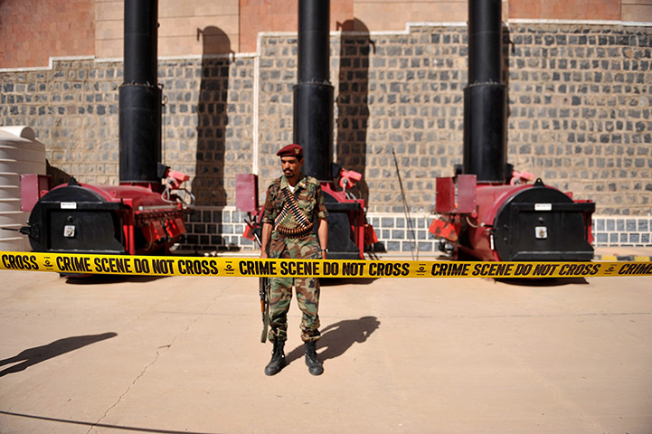 24 hours in pictures: Soldier in front of incinerators where bags of illicit drugs are burned