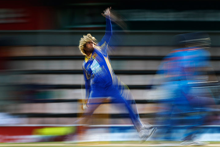 Best of the week: Sri Lanka's Malinga bowls during their Tri-series odi match against India
