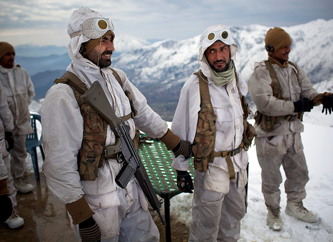 Featured Photojournalist: Soldiers gather before setting out on a patrol near the Kalpani base