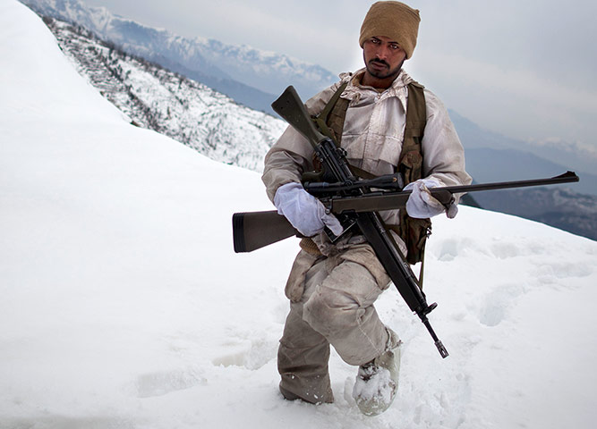 Featured Photojournalist: A soldier on patrol near the Kalpani base