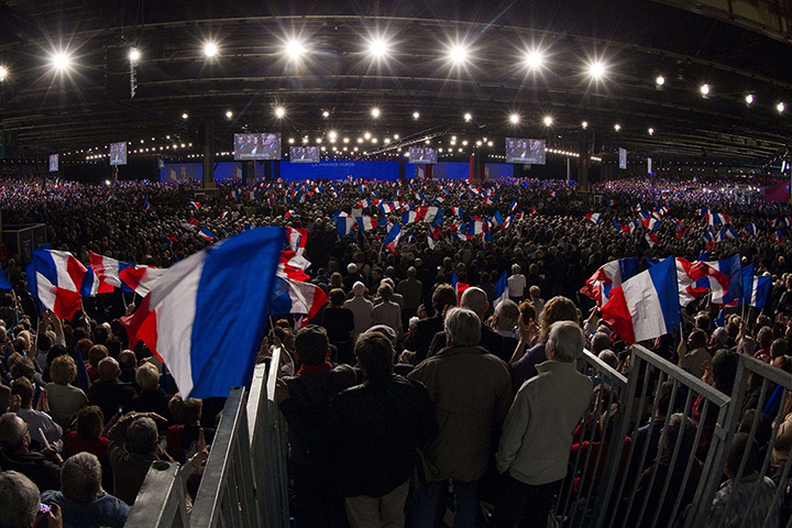 Sarkozy rally: Supporters of Sarkozy wave flags during a campaign meeting 