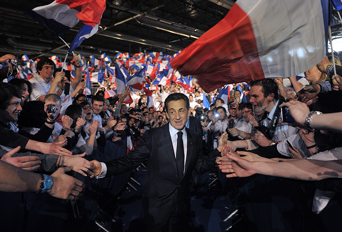 Sarkozy rally: Nicolas Sarkozy greets supporters as he arrives for a campaign meeting