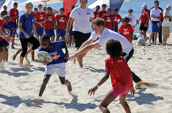 Prince Harry on tour: 10 March: Prince Harry plays rugby with children in Rio
