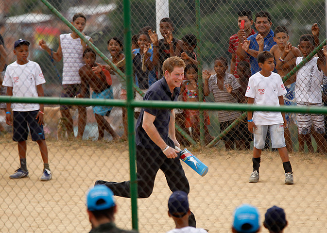Prince Harry on tour: Prince Harry plays cricket during his visit to Rio de Janeiro