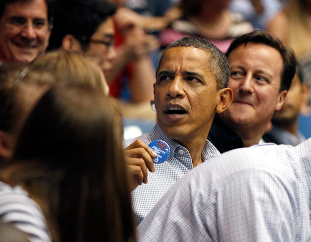 Camerons in US: Barack Obama turns around as a supporter passes him a campaign pin